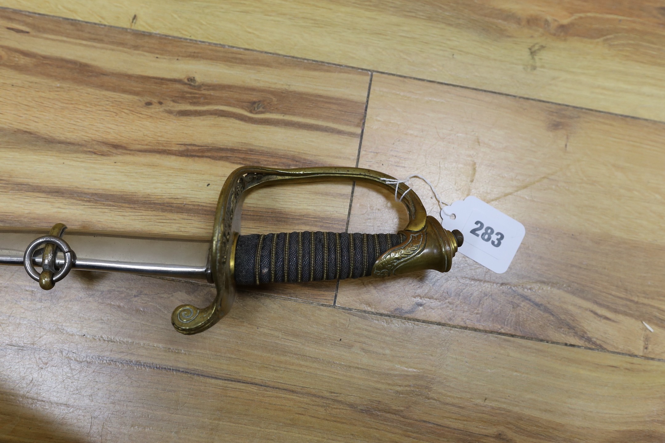 A United States Marines dress sword made by Wilkinson, the blade etched ‘S/SGT. JAMES P.S. DEVEREUX II. 1340836 U.S.M.C.’ with scabbard. Total length 107cm